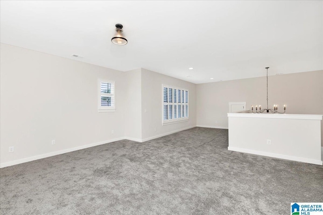 4546 Brexton St, Trussville, AL 35173 - unfurnished room with an inviting chandelier, baseboards, carpet flooring, and visible vents