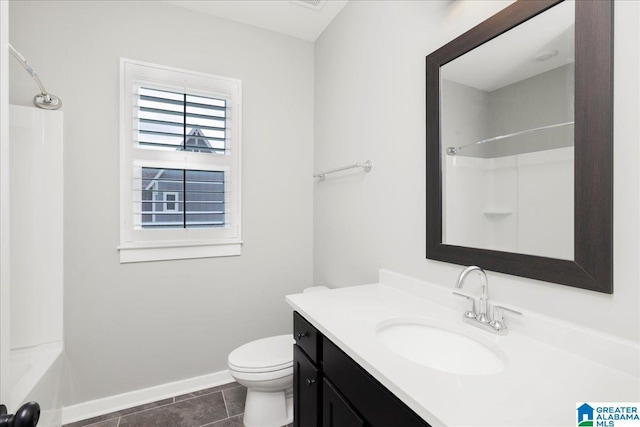 4546 Brexton St, Trussville, AL 35173 - bathroom with washtub / shower combination, vanity, toilet, tile patterned floors, and baseboards