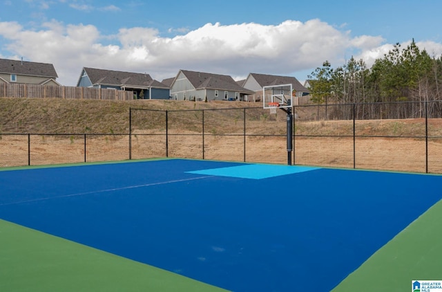 4546 Brexton St, Trussville, AL 35173 - view of sport court featuring a residential view, fence, and basketball hoop