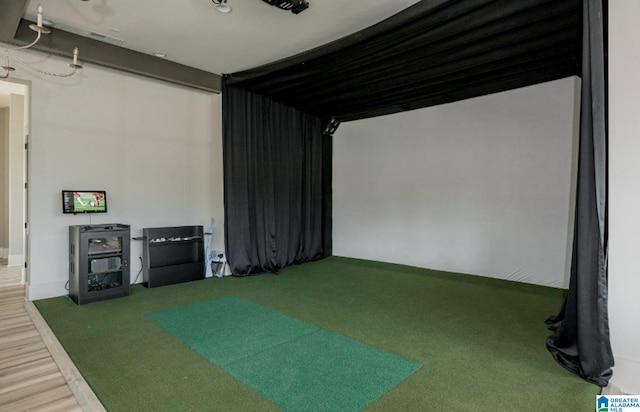 4546 Brexton St, Trussville, AL 35173 - game room featuring golf simulator and wood finished floors