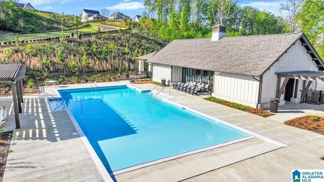 4546 Brexton St, Trussville, AL 35173 - pool featuring a pergola, fence, an outbuilding, and a patio area
