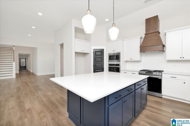 4546 Brexton St, Trussville, AL 35173 - kitchen with custom exhaust hood, white cabinets, and stainless steel appliances