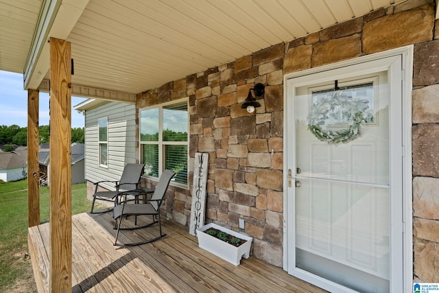 property entrance featuring stone siding