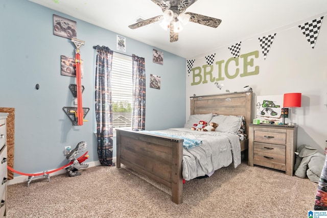 bedroom with visible vents, a ceiling fan, baseboards, and light carpet