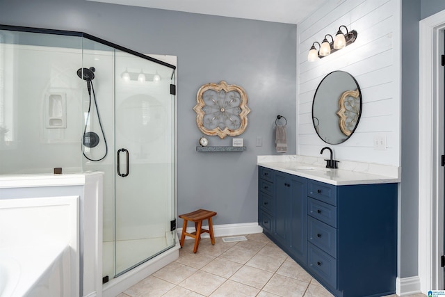 605 N Grande View Cir, Maylene, AL 35114 - bathroom featuring tile patterned flooring, a shower stall, vanity, a bath, and baseboards
