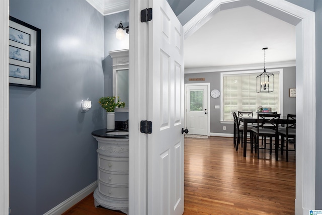 605 N Grande View Cir, Maylene, AL 35114 - hallway with crown molding, baseboards, wood finished floors, and a chandelier
