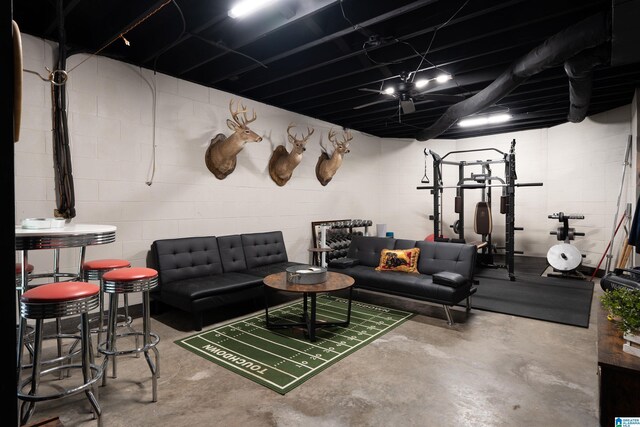 605 N Grande View Cir, Maylene, AL 35114 - living room featuring concrete floors and concrete block wall