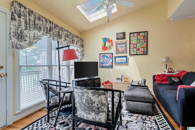 934 Chestnut Oaks Cir, Hoover, AL 35244 - living room with ceiling fan, lofted ceiling, a skylight, and wood finished floors