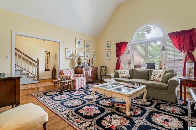 934 Chestnut Oaks Cir, Hoover, AL 35244 - living area featuring high vaulted ceiling, wood finished floors, and stairway