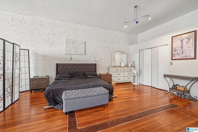bedroom featuring hardwood / wood-style flooring and a closet
