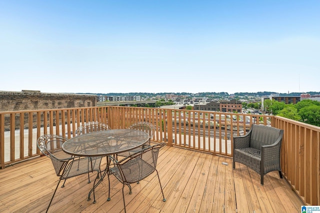 wooden deck featuring outdoor dining space
