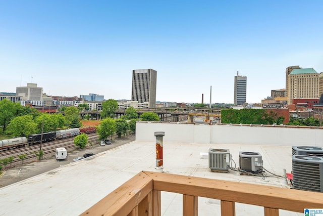 view of patio with central AC and a view of city