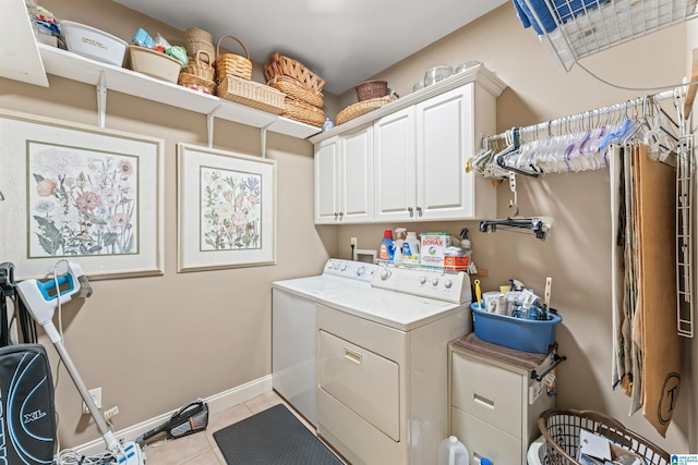 2608 Arbor Way, Hoover, AL 35244 - laundry area featuring cabinet space, washing machine and clothes dryer, light tile patterned flooring, and baseboards