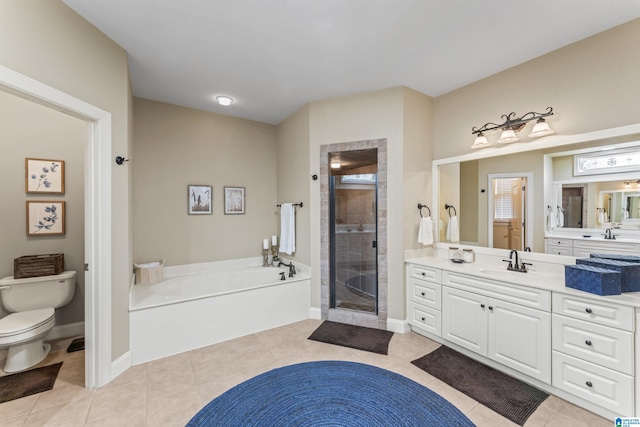 2608 Arbor Way, Hoover, AL 35244 - bathroom featuring a shower stall, toilet, a garden tub, tile patterned flooring, and vanity