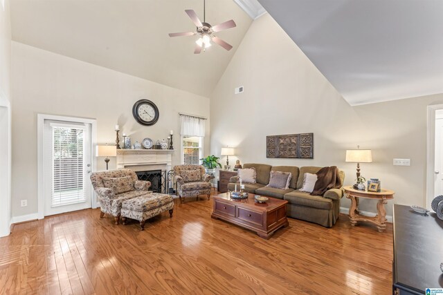 2608 Arbor Way, Hoover, AL 35244 - living room featuring high vaulted ceiling, a ceiling fan, a fireplace, wood finished floors, and baseboards