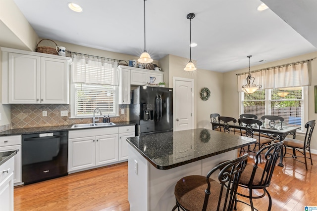 2608 Arbor Way, Hoover, AL 35244 - kitchen with black appliances, a sink, healthy amount of natural light, white cabinets, and recessed lighting