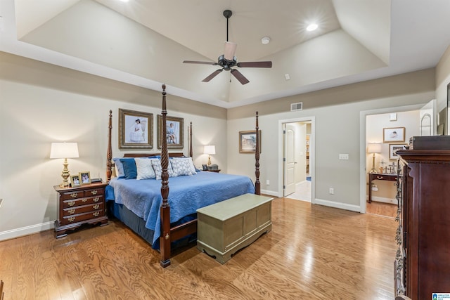 2608 Arbor Way, Hoover, AL 35244 - bedroom with light wood-type flooring, ensuite bath, baseboards, a tray ceiling, and recessed lighting