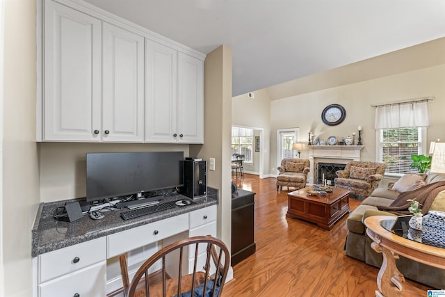 2608 Arbor Way, Hoover, AL 35244 - home office with light wood finished floors, vaulted ceiling, and a fireplace