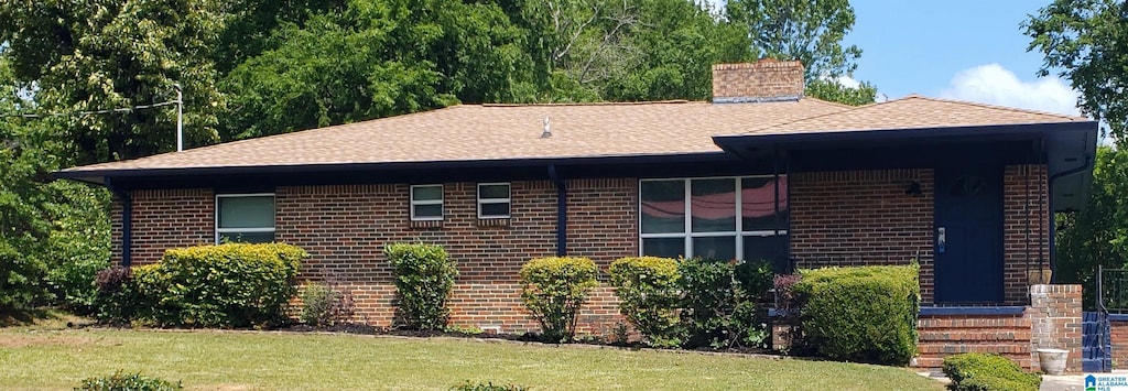 4417 Campbell Ln, Birmingham, AL 35207 - view of home's exterior featuring brick siding, roof with shingles, and a chimney
