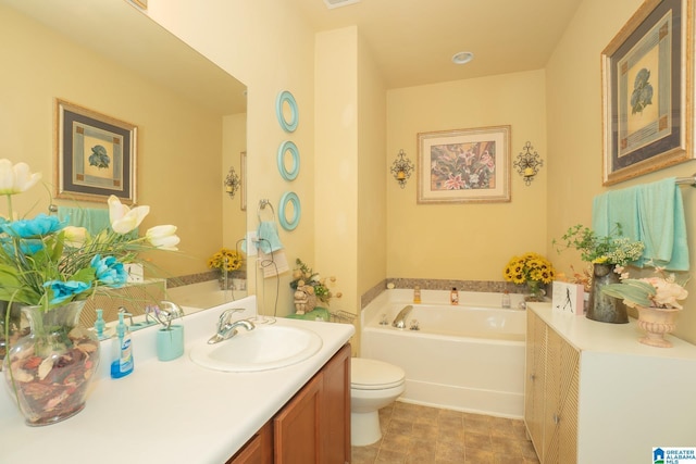 full bath featuring vanity, toilet, a garden tub, and visible vents