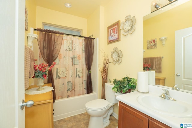 bathroom with toilet, shower / bath combo, and vanity
