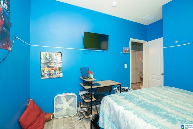 bedroom featuring wood finished floors