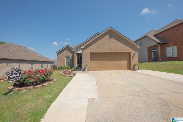 single story home with concrete driveway, an attached garage, brick siding, and a front yard