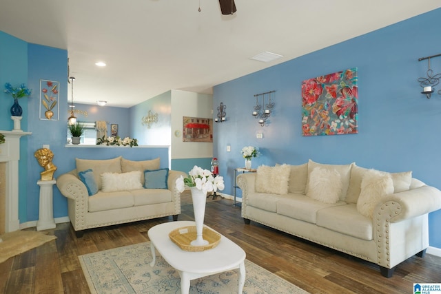 living area featuring baseboards, visible vents, recessed lighting, and wood finished floors