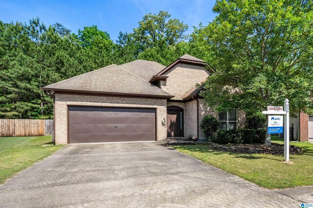 4126 Jubilee Ln, Moody, AL 35004 - view of front of property featuring a garage, brick siding, driveway, and a shingled roof