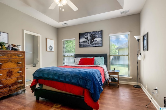 4126 Jubilee Ln, Moody, AL 35004 - bedroom with multiple windows, wood finished floors, connected bathroom, and baseboards