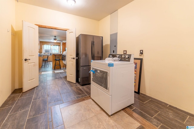 laundry room with electric panel, washer / clothes dryer, laundry area, dark wood finished floors, and ceiling fan
