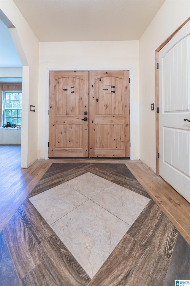 foyer featuring wood finished floors