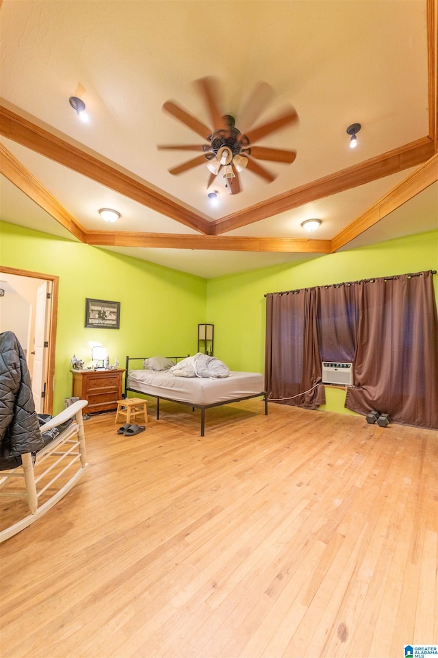 bedroom with light wood finished floors, a wall mounted air conditioner, and beamed ceiling