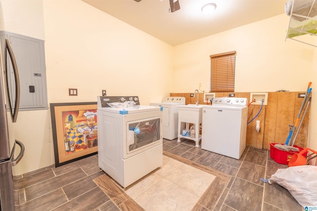 laundry area with a sink, laundry area, ceiling fan, and washer and dryer