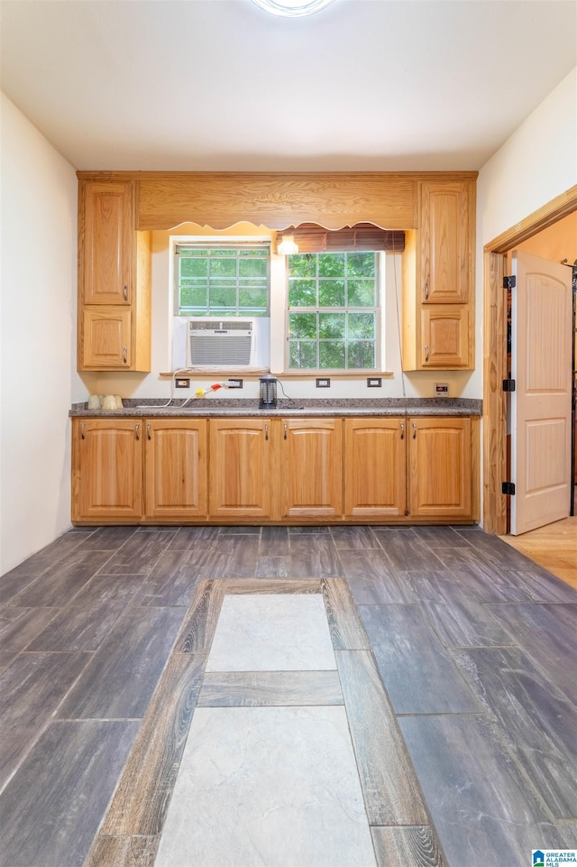 kitchen with cooling unit and dark stone counters