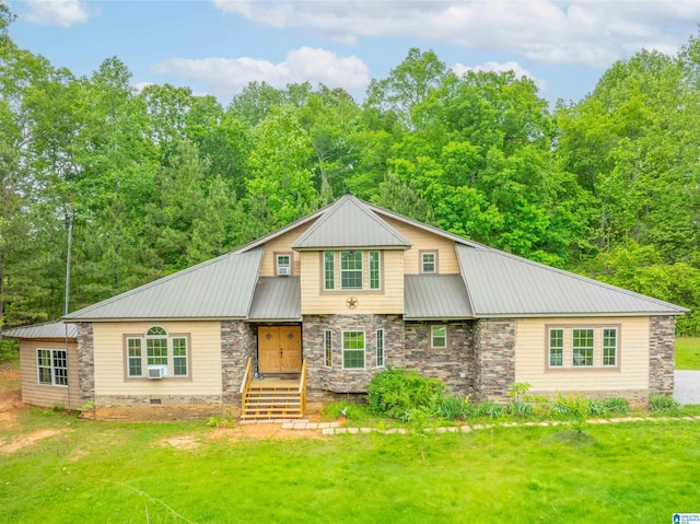 view of front of house featuring stone siding, metal roof, and a front lawn