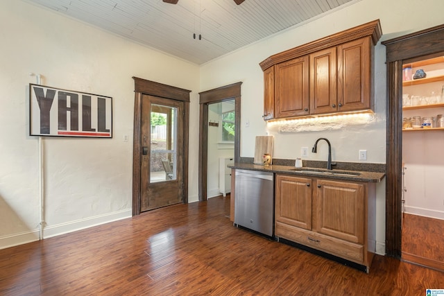 kitchen with stainless steel dishwasher, a sink, ceiling fan, brown cabinets, and dark wood-type flooring