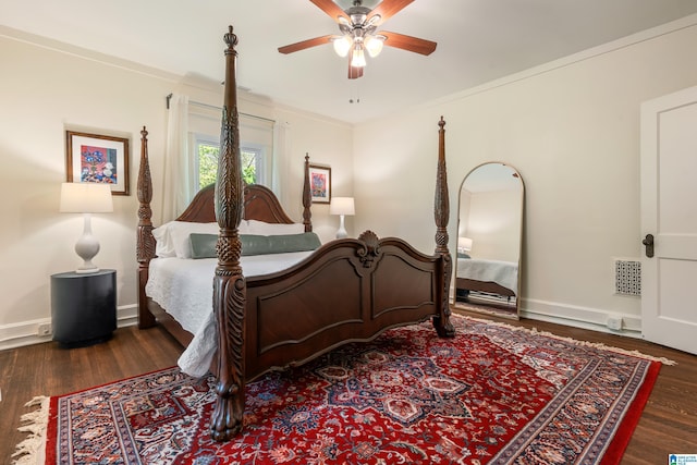bedroom with wood finished floors, ceiling fan, baseboards, and ornamental molding