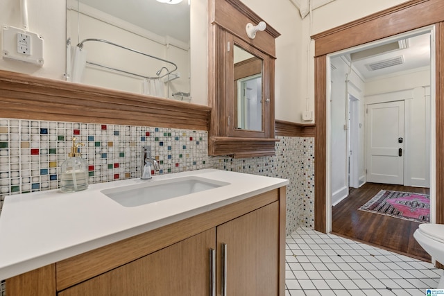 bathroom featuring vanity, toilet, tile patterned flooring, and a shower with curtain