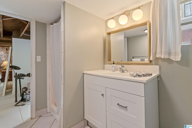 bathroom with a shower with curtain, vanity, and tile patterned flooring