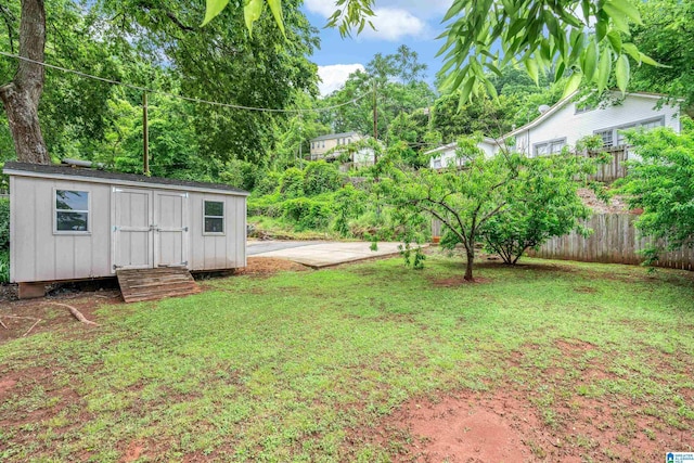 view of yard with an outbuilding and a shed