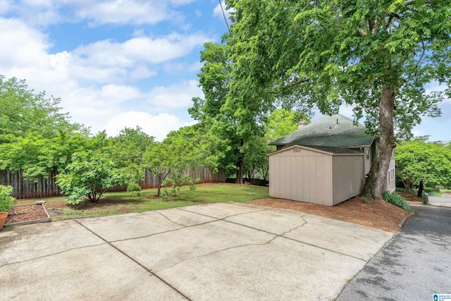 view of patio / terrace featuring a shed and an outdoor structure