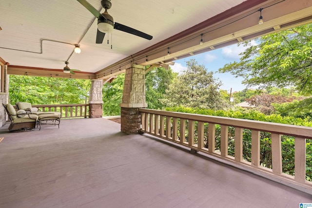 view of patio featuring a ceiling fan and a porch