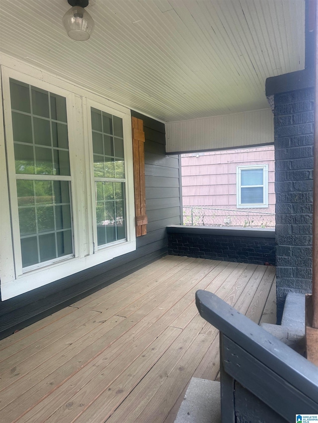 wooden terrace featuring ceiling fan