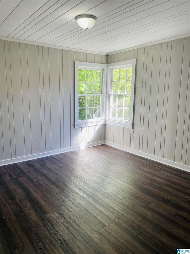 unfurnished room with dark wood finished floors