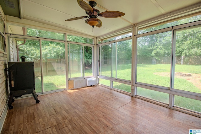 unfurnished sunroom featuring a ceiling fan and visible vents