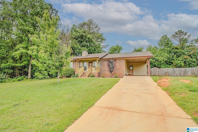 single story home featuring fence, brick siding, driveway, a front lawn, and a chimney