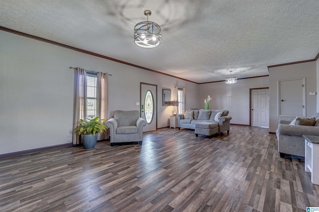 living room with baseboards, a notable chandelier, a textured ceiling, and wood finished floors