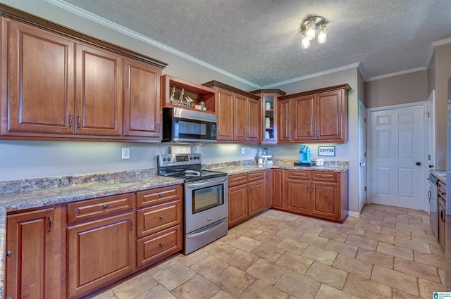 kitchen featuring brown cabinetry, stainless steel appliances, and glass insert cabinets