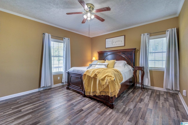 bedroom featuring wood finished floors, a ceiling fan, a textured ceiling, baseboards, and ornamental molding